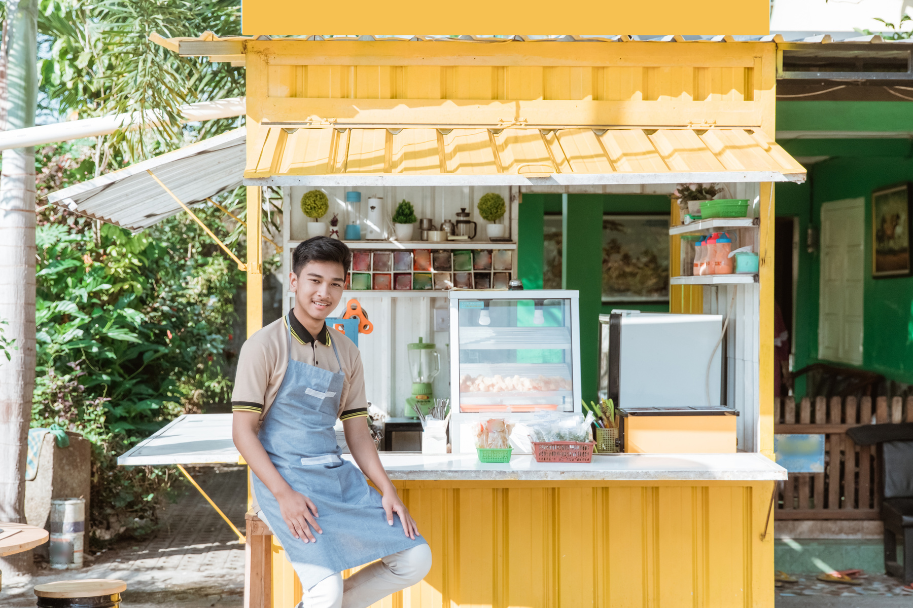 Asian Man Small Business Owner at His Shop Made of Truck Container